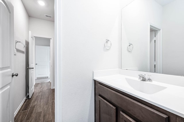 bathroom featuring vanity and hardwood / wood-style flooring