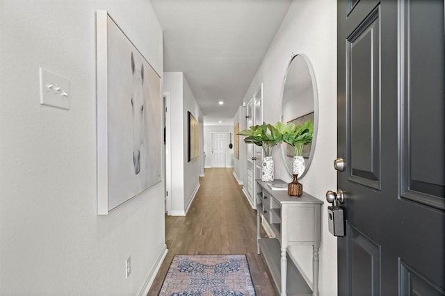 corridor featuring dark hardwood / wood-style flooring