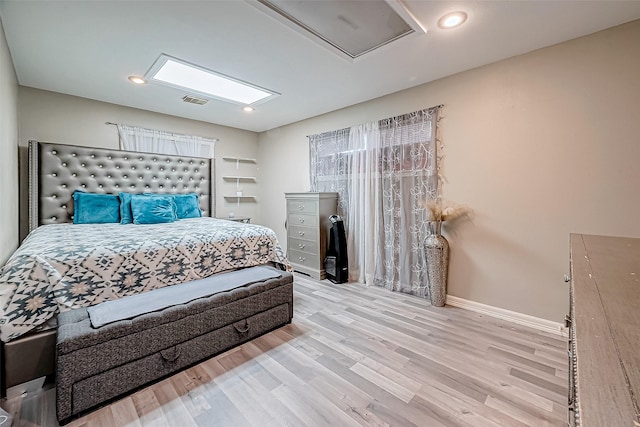 bedroom with light hardwood / wood-style flooring