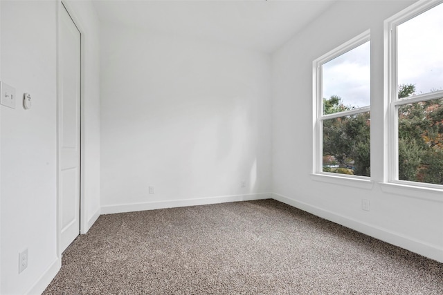 unfurnished bedroom with carpet flooring