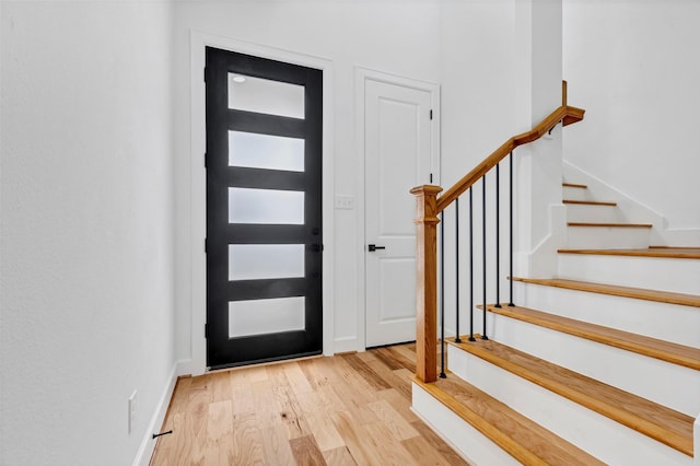 foyer entrance with light hardwood / wood-style flooring