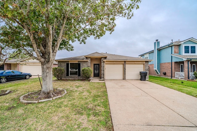 view of front of house featuring a front yard and a garage