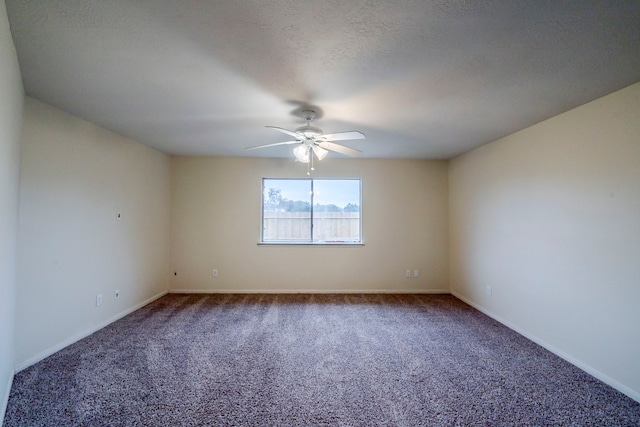 carpeted spare room with a textured ceiling and ceiling fan