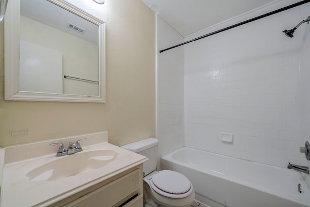 full bathroom with vanity, tiled shower / bath combo, and toilet