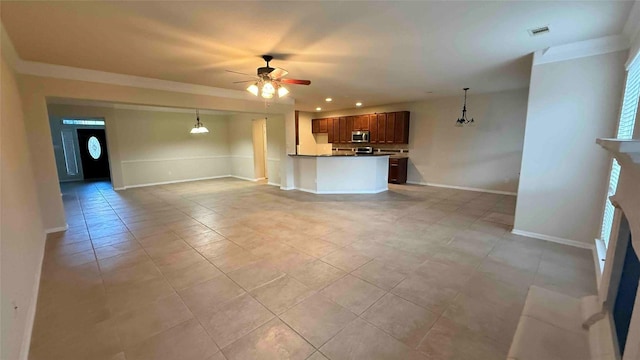 unfurnished living room featuring ceiling fan and light tile patterned floors