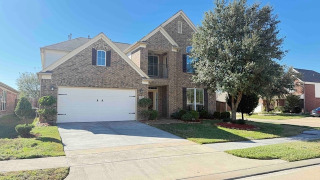 view of front of house with a front yard and a garage