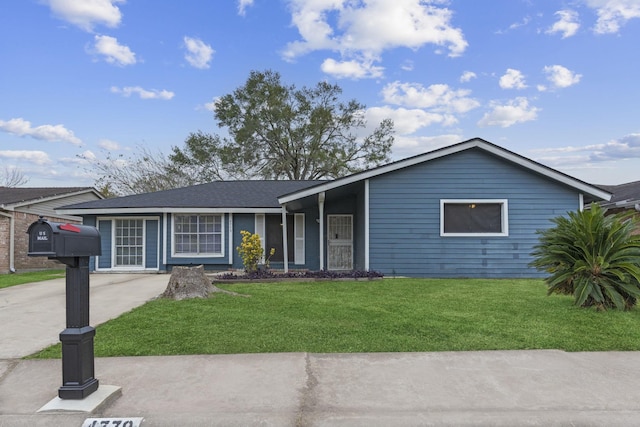 single story home featuring a front lawn