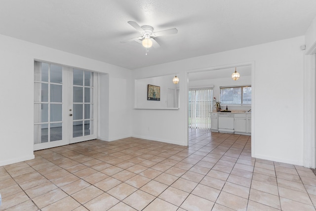 tiled empty room with french doors and ceiling fan