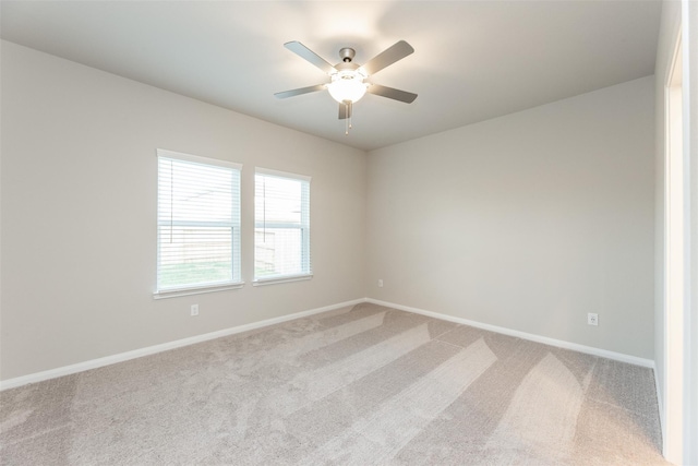 empty room with light carpet and ceiling fan