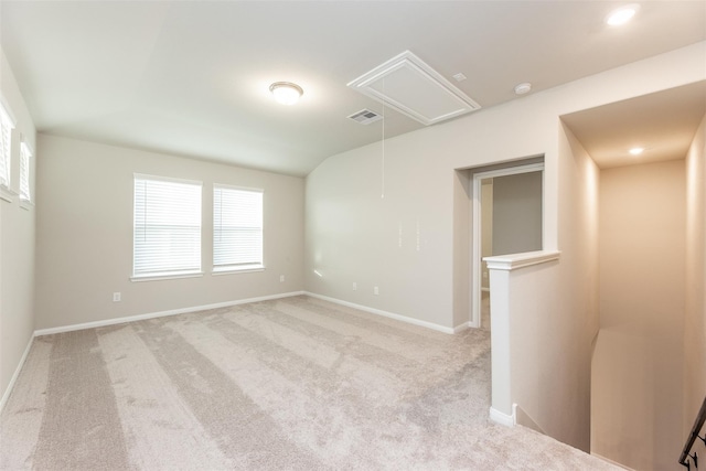 empty room with light colored carpet and a wealth of natural light