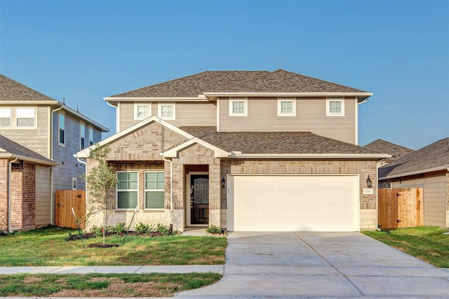 view of front of home with a front lawn and a garage