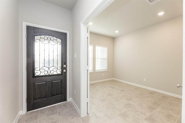 foyer featuring light tile patterned flooring