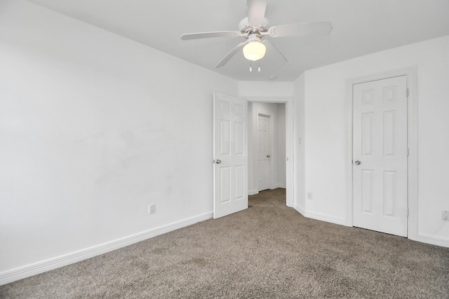 unfurnished bedroom with ceiling fan and carpet floors