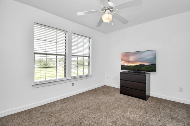 unfurnished living room with carpet flooring and ceiling fan