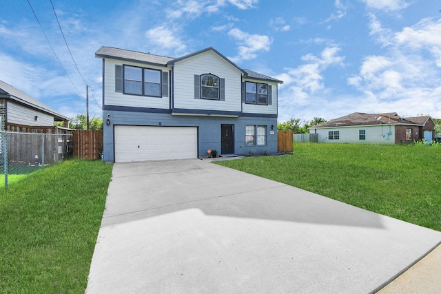 front of property featuring a front lawn and a garage