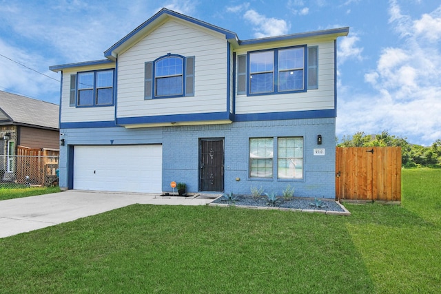 view of front facade with a front yard and a garage