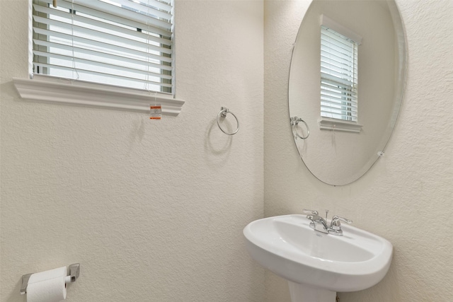 bathroom with sink and a wealth of natural light