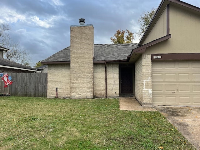 property entrance featuring a garage and a lawn