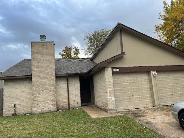 view of front facade with a front yard and a garage