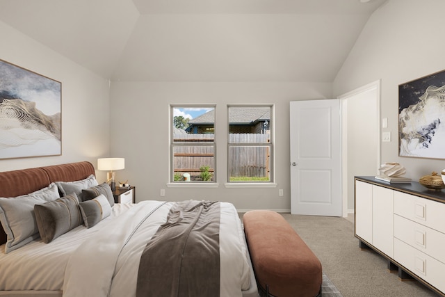 bedroom featuring carpet and lofted ceiling