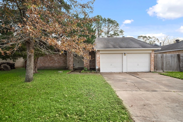 view of front of home featuring a garage and a front yard