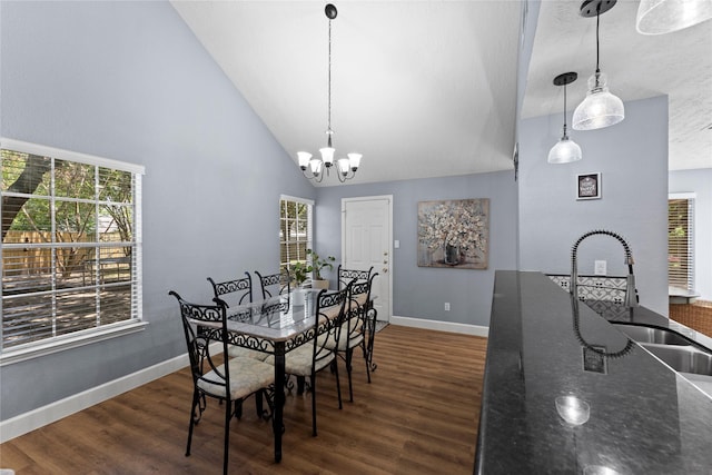 dining space featuring a chandelier, a wealth of natural light, and dark wood-type flooring