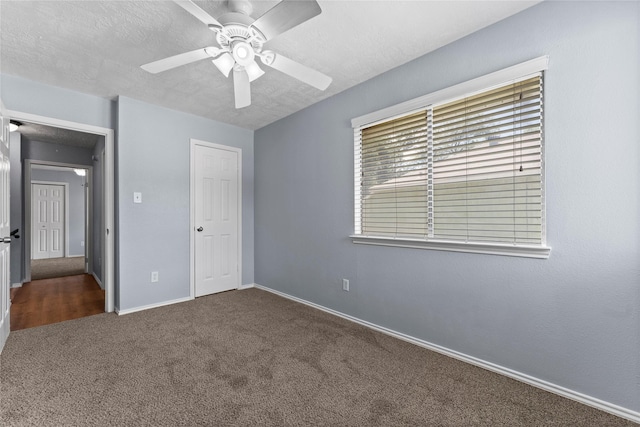 unfurnished bedroom featuring carpet flooring, a closet, and ceiling fan