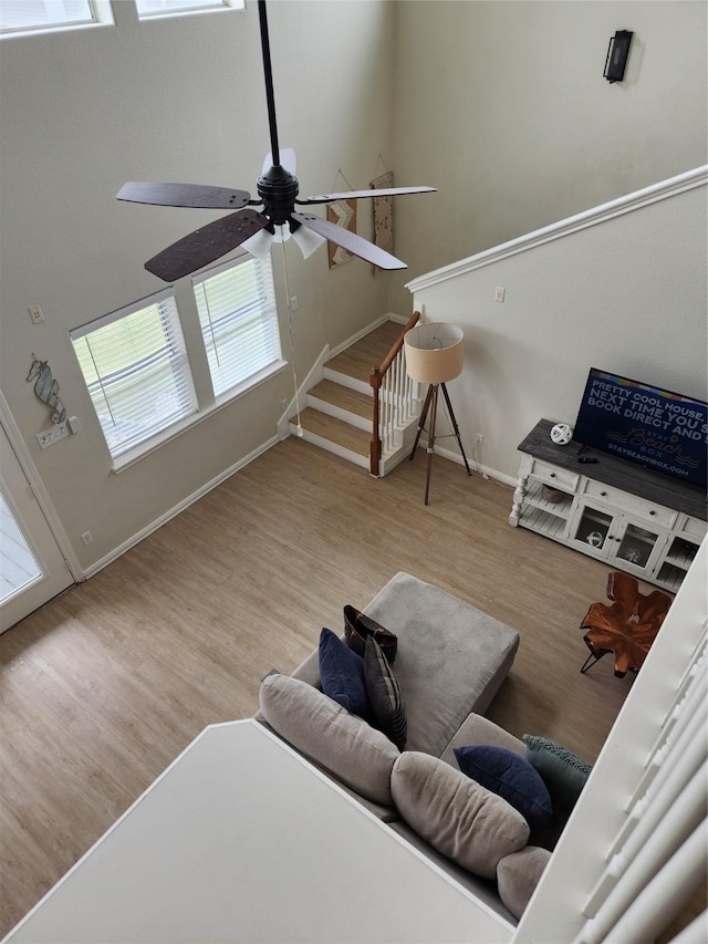 22901 Buena St, Galveston, TX 77554 - living room with light hardwood / wood-style flooring and ceiling fan