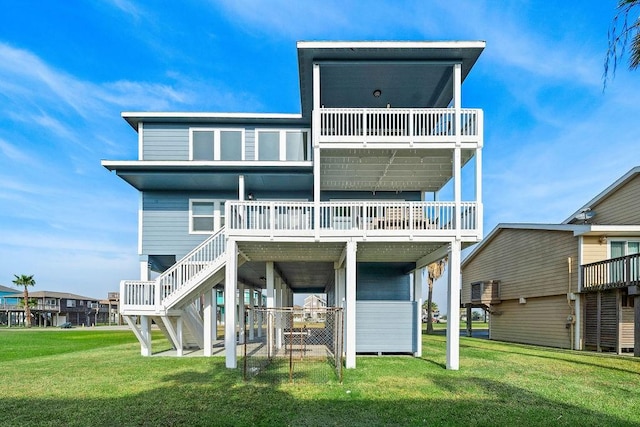 rear view of property with a lawn