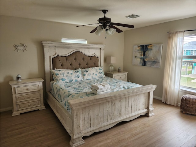 22901 Buena St, Galveston, TX 77554 - bedroom with hardwood / wood-style floors and ceiling fan
