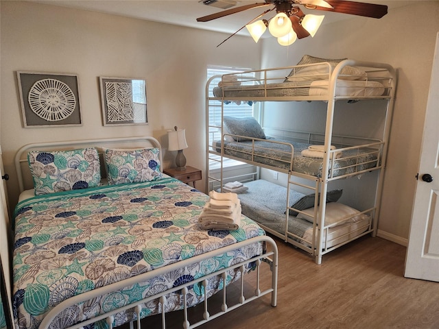 22901 Buena St, Galveston, TX 77554 - bedroom with hardwood / wood-style flooring and ceiling fan