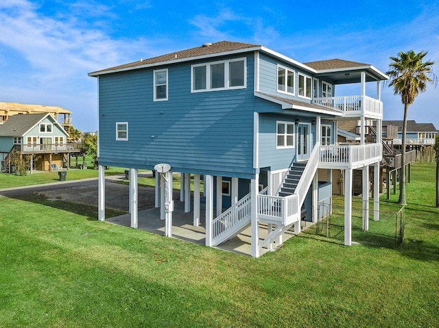 22901 Buena St, Galveston, TX 77554 - back of property featuring a yard and a balcony