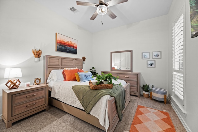 carpeted bedroom with ceiling fan