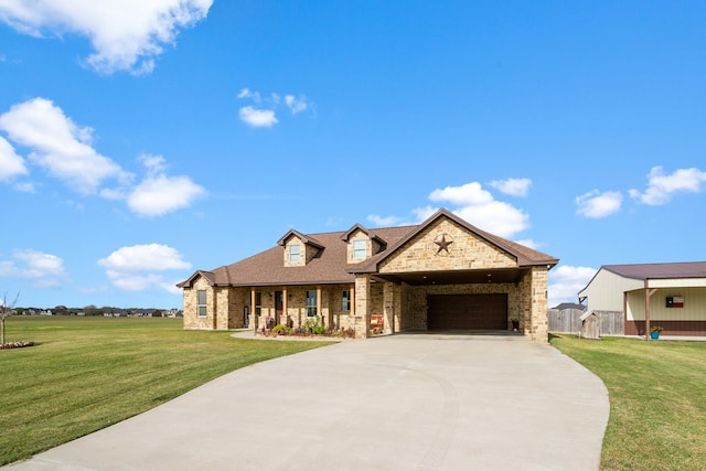 view of front of property featuring a front yard and a garage