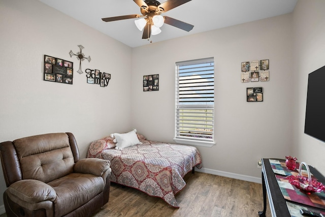 bedroom featuring hardwood / wood-style floors and ceiling fan