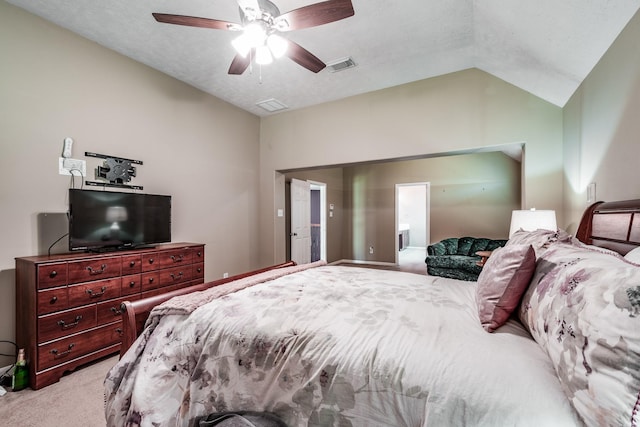 carpeted bedroom with ceiling fan, lofted ceiling, and a textured ceiling