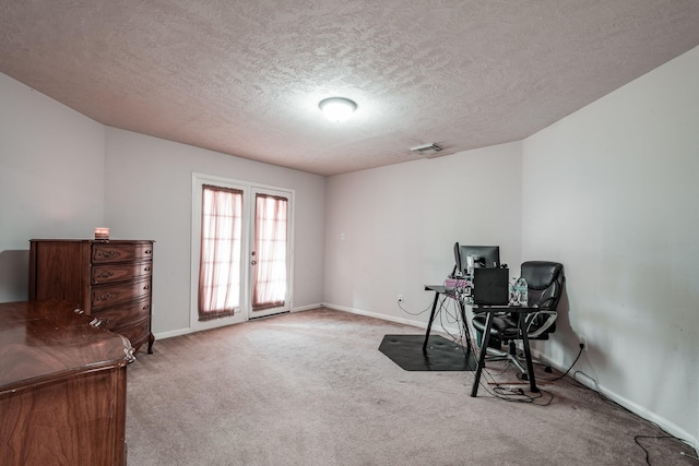 office area featuring carpet, french doors, and a textured ceiling