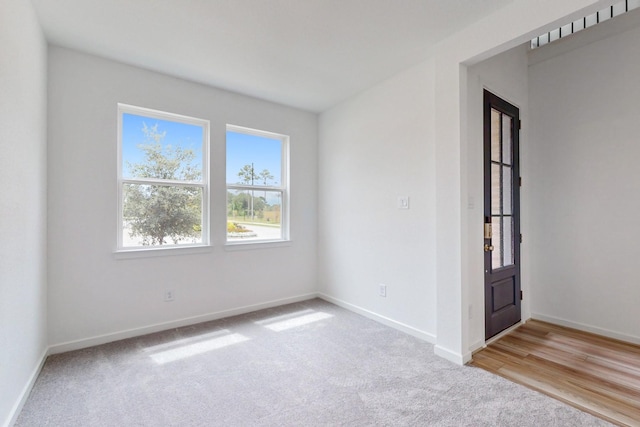 empty room with light wood-type flooring