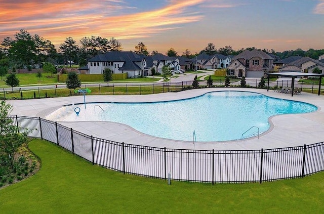 pool at dusk with a yard