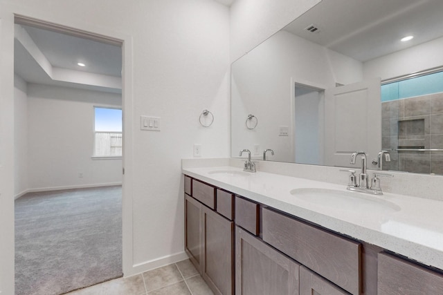 bathroom with vanity and tile patterned floors