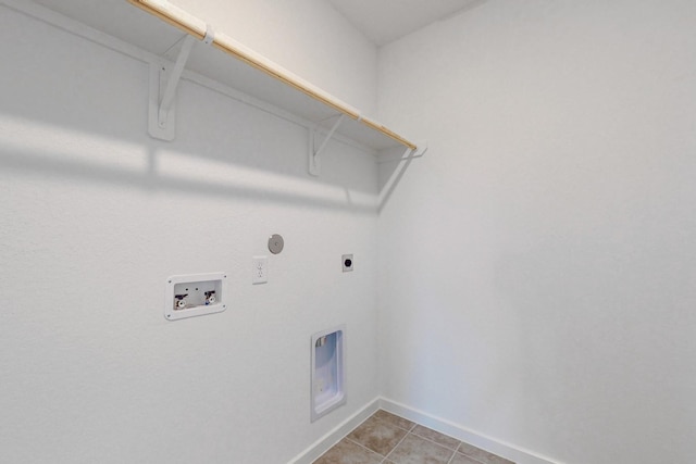 laundry area featuring hookup for an electric dryer, washer hookup, and light tile patterned floors