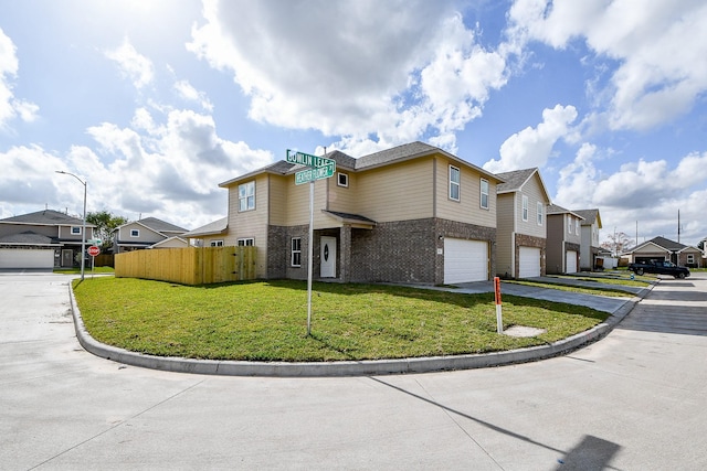 view of front of home featuring a garage and a front lawn