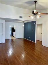 unfurnished living room featuring dark hardwood / wood-style floors