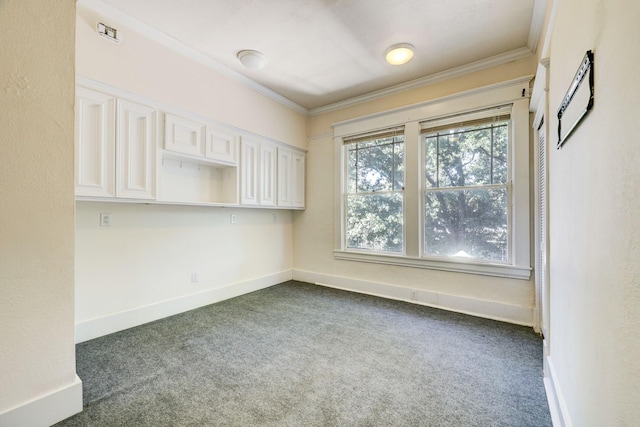 carpeted empty room featuring ornamental molding