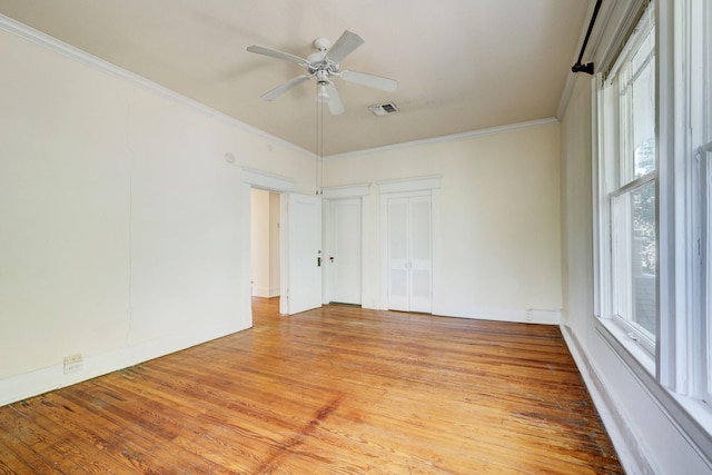 unfurnished room with ceiling fan, light hardwood / wood-style floors, and ornamental molding