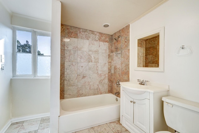 full bathroom featuring crown molding, vanity, tiled shower / bath combo, and toilet