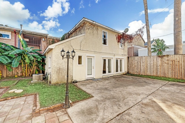 back of house with a patio area and french doors