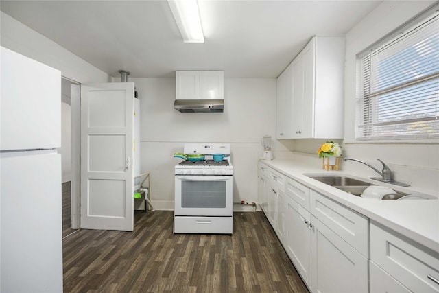 kitchen with white appliances, exhaust hood, white cabinets, sink, and dark hardwood / wood-style flooring