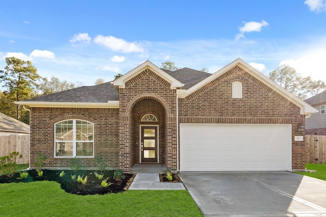 front facade with a front yard and a garage