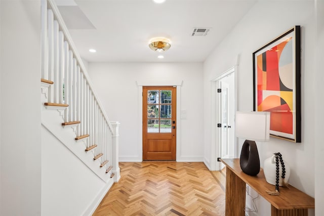 entryway featuring light parquet floors